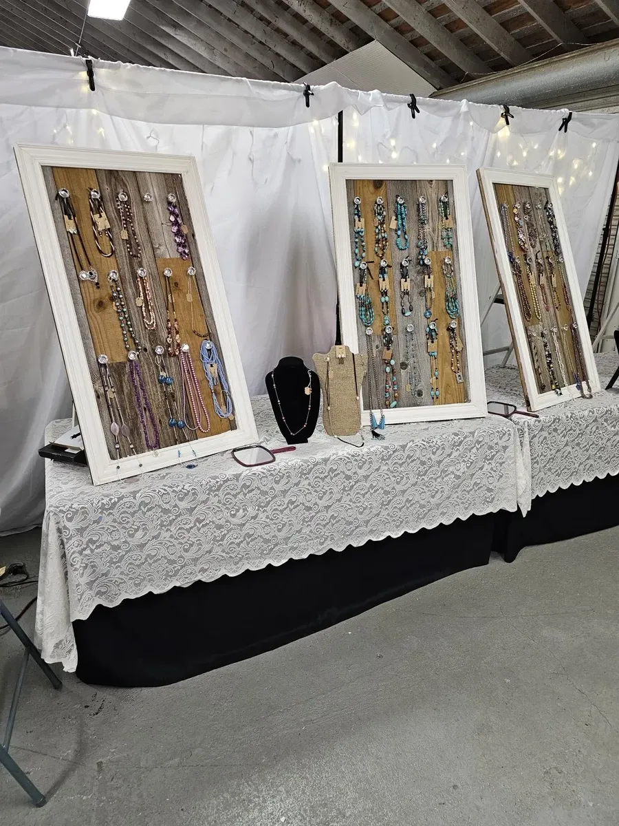 Jewelry display cases on tables at craft show