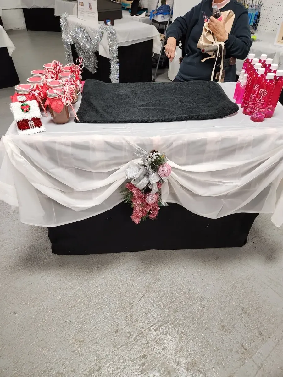 Holiday craft show table with festive jewelry display