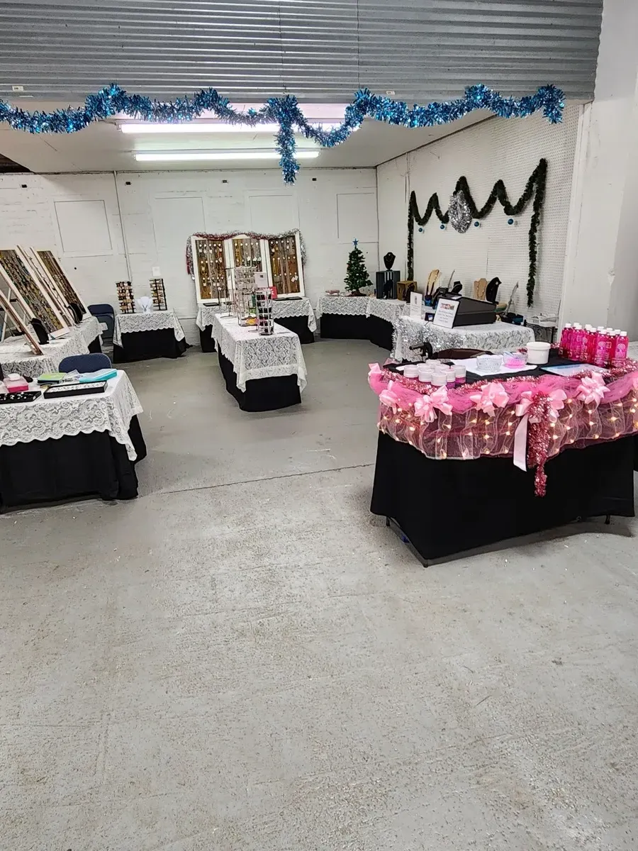 Indoor holiday craft show booth display with jewelry